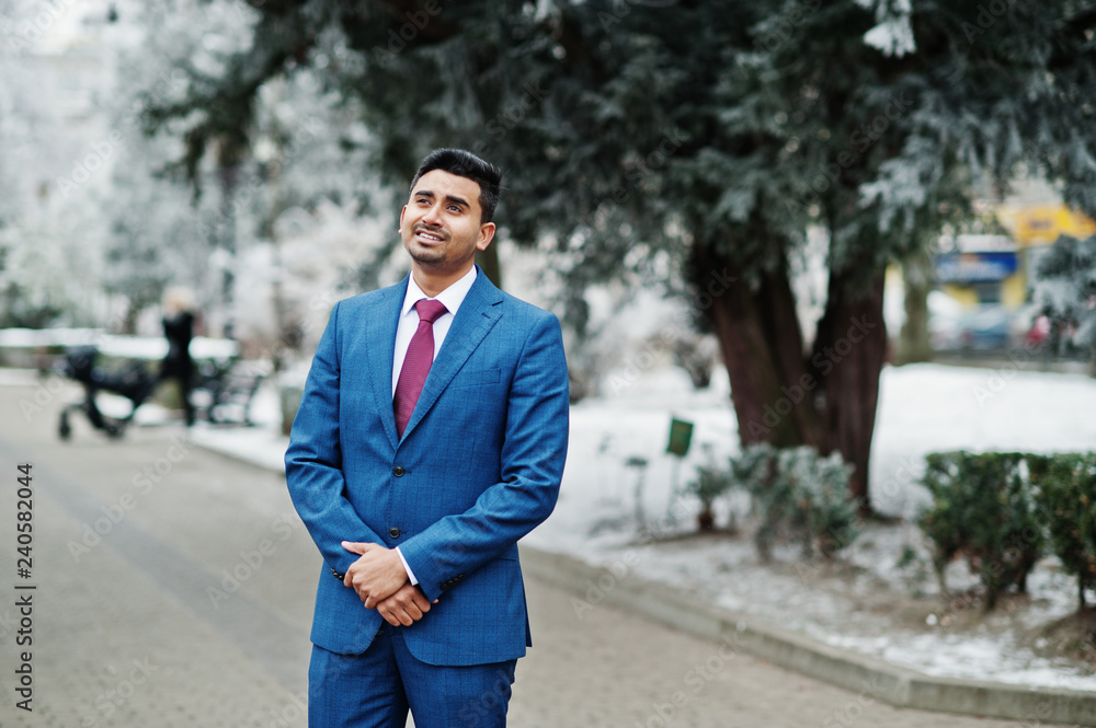 Elegant indian fashionable man model on suit posed at winter day. Elegant indian fashionable man model on suit posed at winter day.