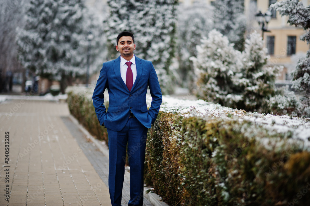Elegant indian fashionable man model on suit posed at winter day. Elegant indian fashionable man model on suit posed at winter day.