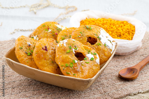 Indian Traditional Sweet Kachori Also Know As Mawa Kachori, Kachauri or Kachodi, Stuffed Kachori With Condensed Milk, Cheese and Dry Fruits And Served With Sugar Syrup photo