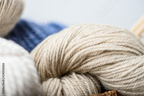close up view of knitting clews on grey backdrop
