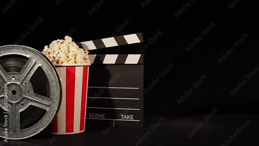 film reel with popcorn and clapboard