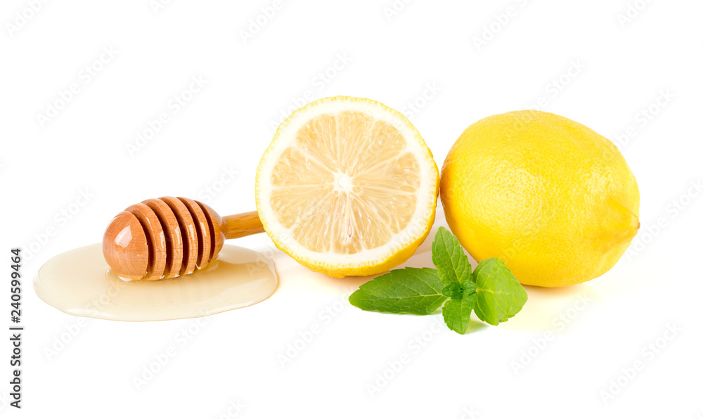 Honey with lemon and mint on white background Honey with lemon and mint on white background