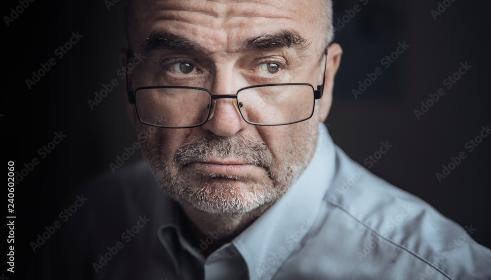 Close up of senior man wearing eyeglasses Close up of senior man wearing eyeglasses