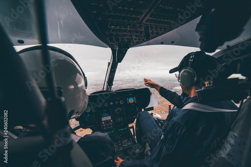 Police pilot during the helicopter flight photo