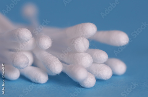 Cotton swabs isolated on blue background