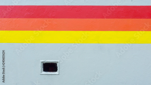 Cuadro en lienzo A tricolor stripe runs along a wall
