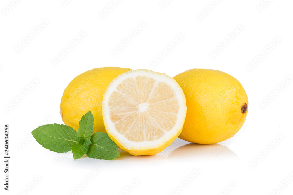 Yellow lemon with mint on a white background Yellow lemon with mint on a white background