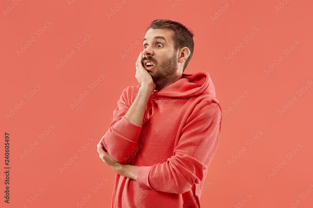 I'm afraid. Fright. Portrait of the scared man. Business man standing isolated on trendy coral studio background. male half-length portrait. Human emotions, facial expression concept I'm afraid. Fright. Portrait of the scared man. Business man standing isolated on trendy coral studio background. male half-length portrait. Human emotions, facial expression concept