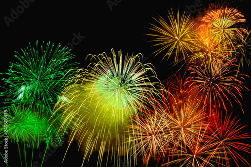 Fireworks of various color bursting against on black background in festival holiday happy new year