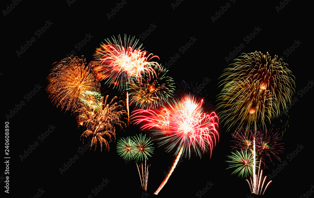 Fireworks of various color bursting against on  black background in festival holiday happy new year