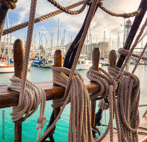 Pin rail with fixed ropes. An old sailing ship photo