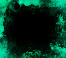 frame from aquamarine smoke over black background