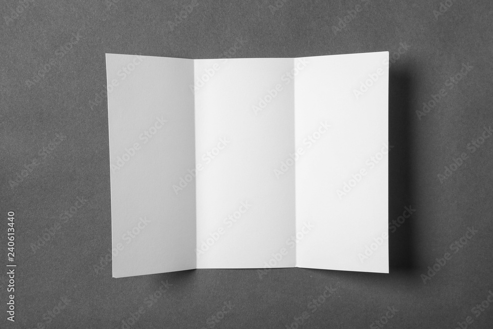 Blank brochure on gray background, view from above. Mock up for design Blank brochure on gray background, view from above. Mock up for design