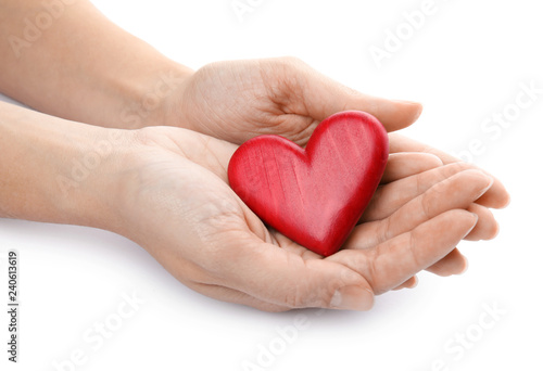 Woman holding red heart on white background  closeup. Cardiology concept