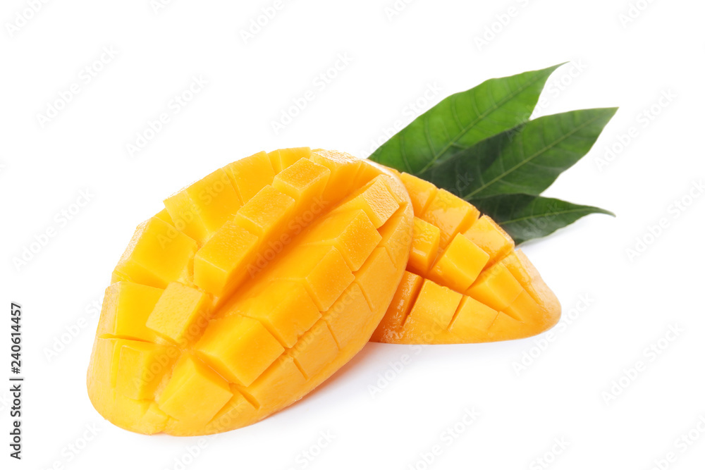 Fresh juicy mango halves and leaves on white background