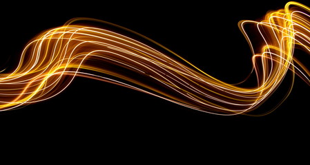 Long exposure light painting photography, curvy lines of vibrant neon metallic yellow gold against a black background