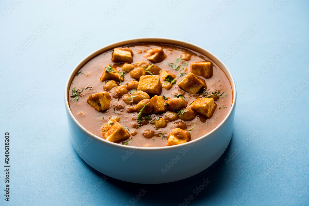 Chole Paneer curry made using boiled chickpea with cottage cheese with spices. Popular North Indian recipe. served in a bowl or serving pan. Selective focus Chole Paneer curry made using boiled chickpea with cottage cheese with spices. Popular North Indian recipe. served in a bowl or serving pan. Selective focus