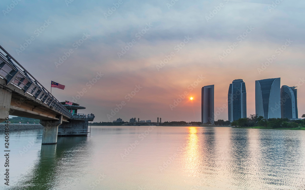 Sun is set near the building