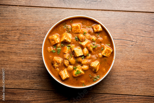 Chole Paneer curry made using boiled chickpea with cottage cheese with spices. Popular North Indian recipe. served in a bowl or serving pan. Selective focus