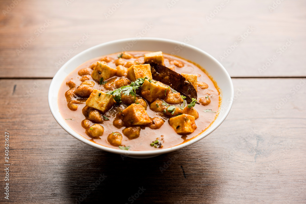Chole Paneer curry made using boiled chickpea with cottage cheese with spices. Popular North Indian recipe. served in a bowl or serving pan. Selective focus Chole Paneer curry made using boiled chickpea with cottage cheese with spices. Popular North Indian recipe. served in a bowl or serving pan. Selective focus