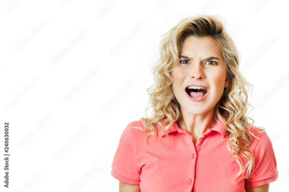Young beautiful emotional girl rejoices and shouts on a white isolated background. Young beautiful emotional girl rejoices and shouts on a white isolated background.