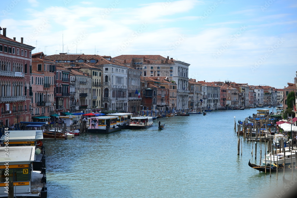 Beautiful colorful city of Venice, Italy, with Italian architecture, gondola, boats and bridges over canal