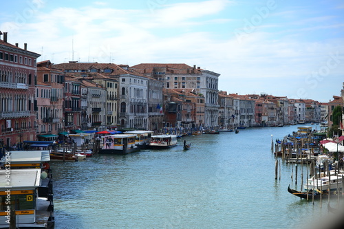 Beautiful colorful city of Venice, Italy, with Italian architecture, gondola, boats and bridges over canal