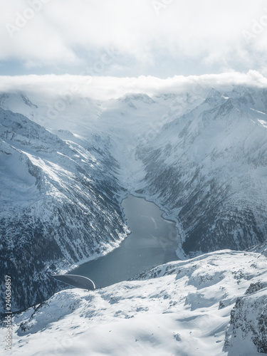  Aerial landscape view of the beautiful snow covered mountains National park Alps in Rakousko,  Picture taken in the mountain Zillertal Arena Tirol, Austria Europe photo