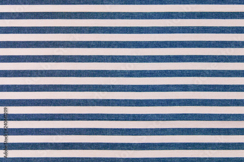 Blue and white stripes fabric background, kitchen towel texture.