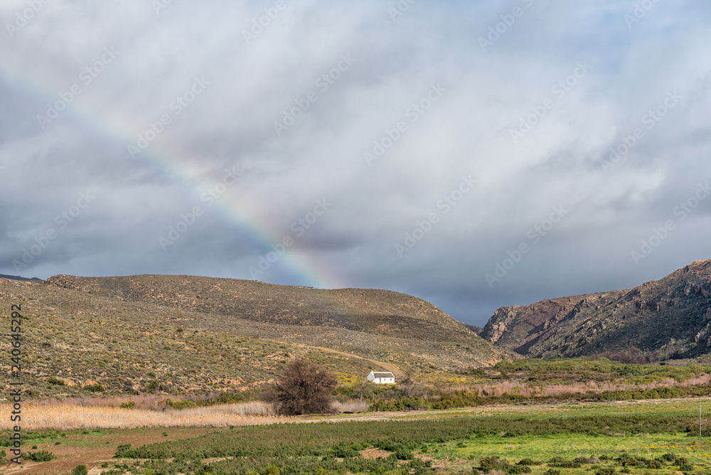 Historic cemetery and a rainbow at Matjiesrivier Nature Reserve