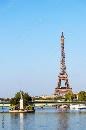 Replica of the Statue of Liberty on the Ile aux Cygnes with Eiffel tower in background - Paris, France