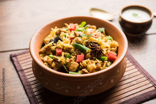 Kheema Pulao - Rice cooked with mutton or chicken mince with vegetables and spices. served in a bowl. selective focus