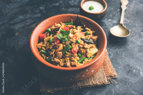 Kheema Pulao - Rice cooked with mutton or chicken mince with vegetables and spices. served in a bowl. selective focus photo