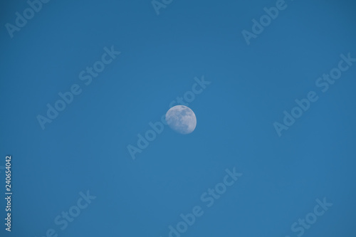 Daytime moon on blue sky.