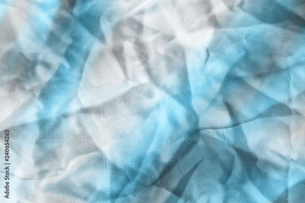 Obraz premium Ocean blue textile background. Silk cloth texture. Fabric jeans pattern.