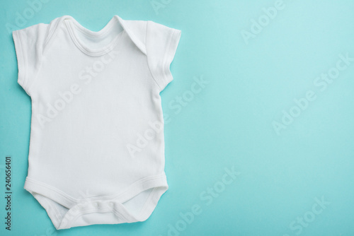 Layout Flat Wear a white baby body shirt, against a blue background. Layout for design and placement of logos, advertising