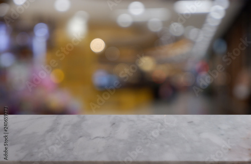 Empty white marble stone table in front of abstract blurred background of shopping mall, cafe and coffee shop interior. can be used for display or montage your products - Image.