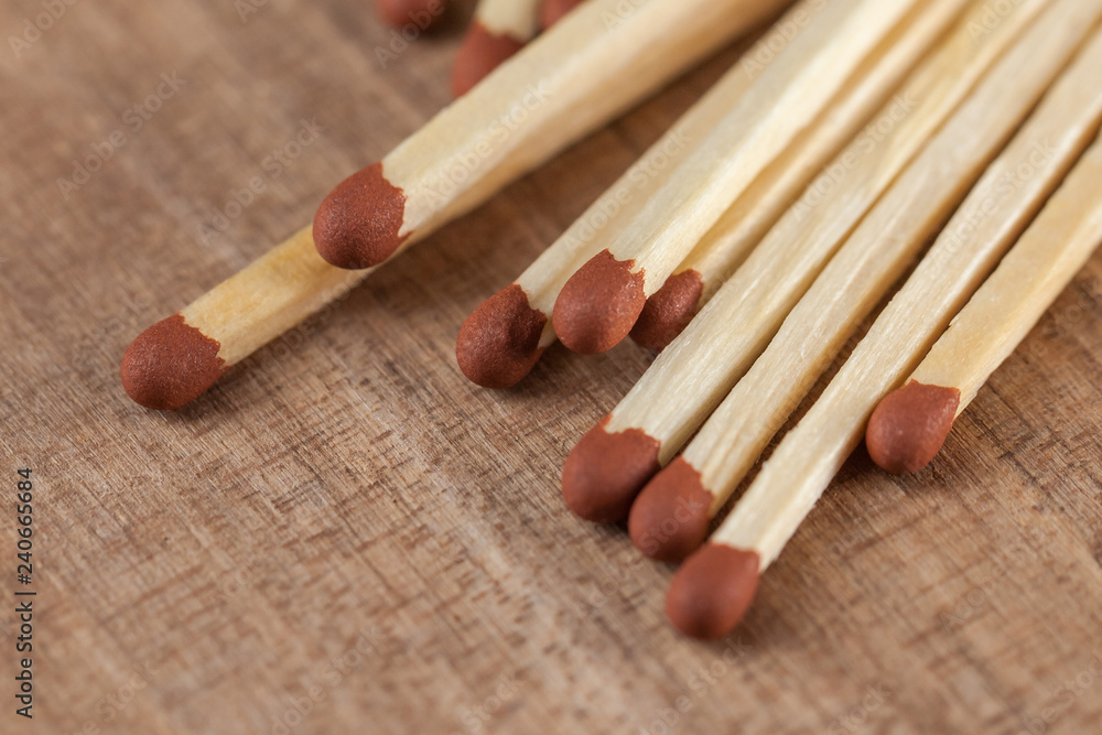 Wooden matches sticks on a wooden table background Wooden matches sticks on a wooden table background