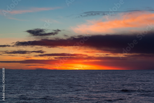 sunrise with clouds on the ocean