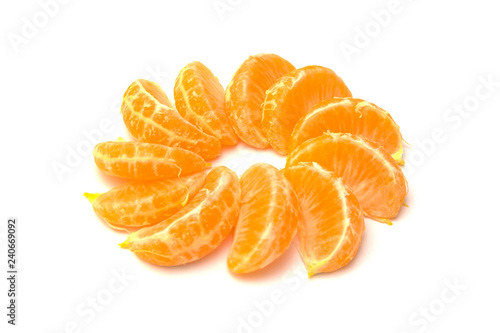 Tangerines slices (oranges, mandarins, clementines, citrus fruits) isolated on a white background.
