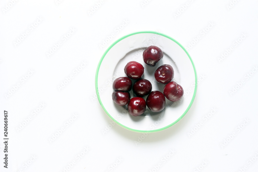 fresh cherries on a plate fresh cherries on a plate