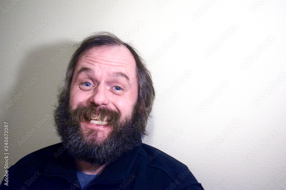 Obraz premium Bearded man 50 years old smiling.