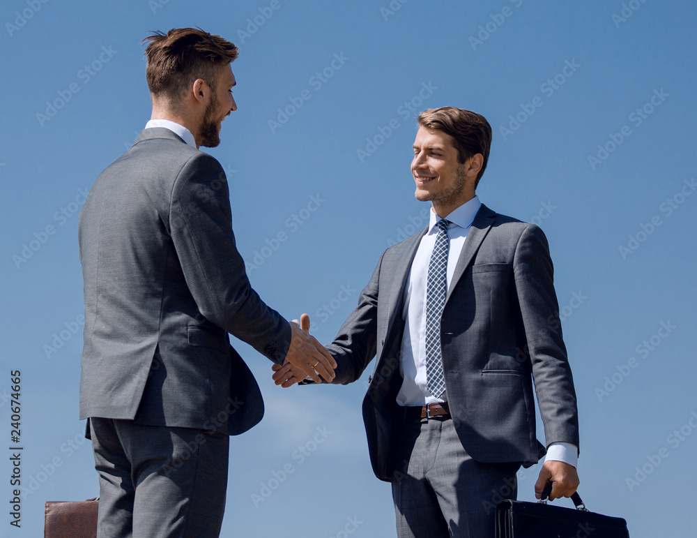 business people greet each other with a handshake business people greet each other with a handshake