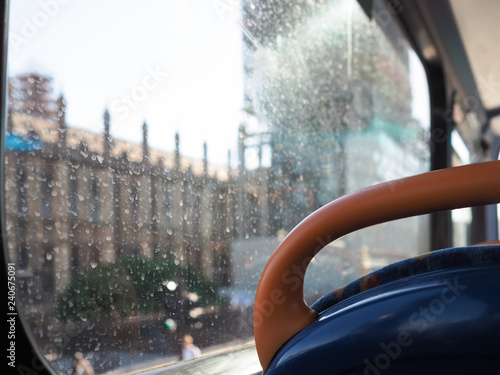 Houses of Parliament, Westminster, London, out of focus through a dirty bus window