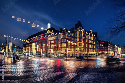 City night scenes with glowing decorations and wet asphalt in Finland, Helsinki