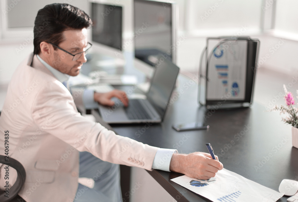 businessman writing down information in a notebook businessman writing down information in a notebook