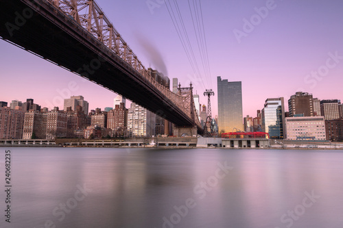 View on Queensboro bridge with tram at sunrise  long exposure shot