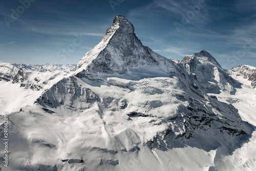 Aerial view of majestic Matterhorn mountain in front of a blue sky