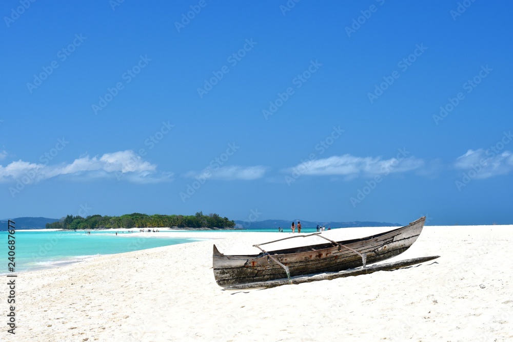 Boat in the sand of a tropical beach
