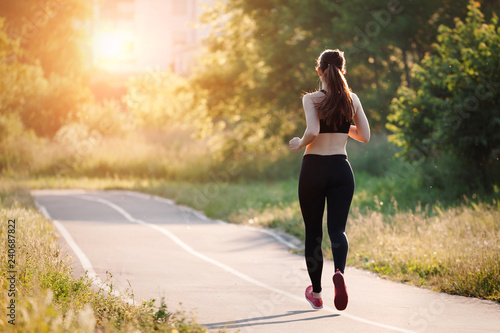 young woman running in park
